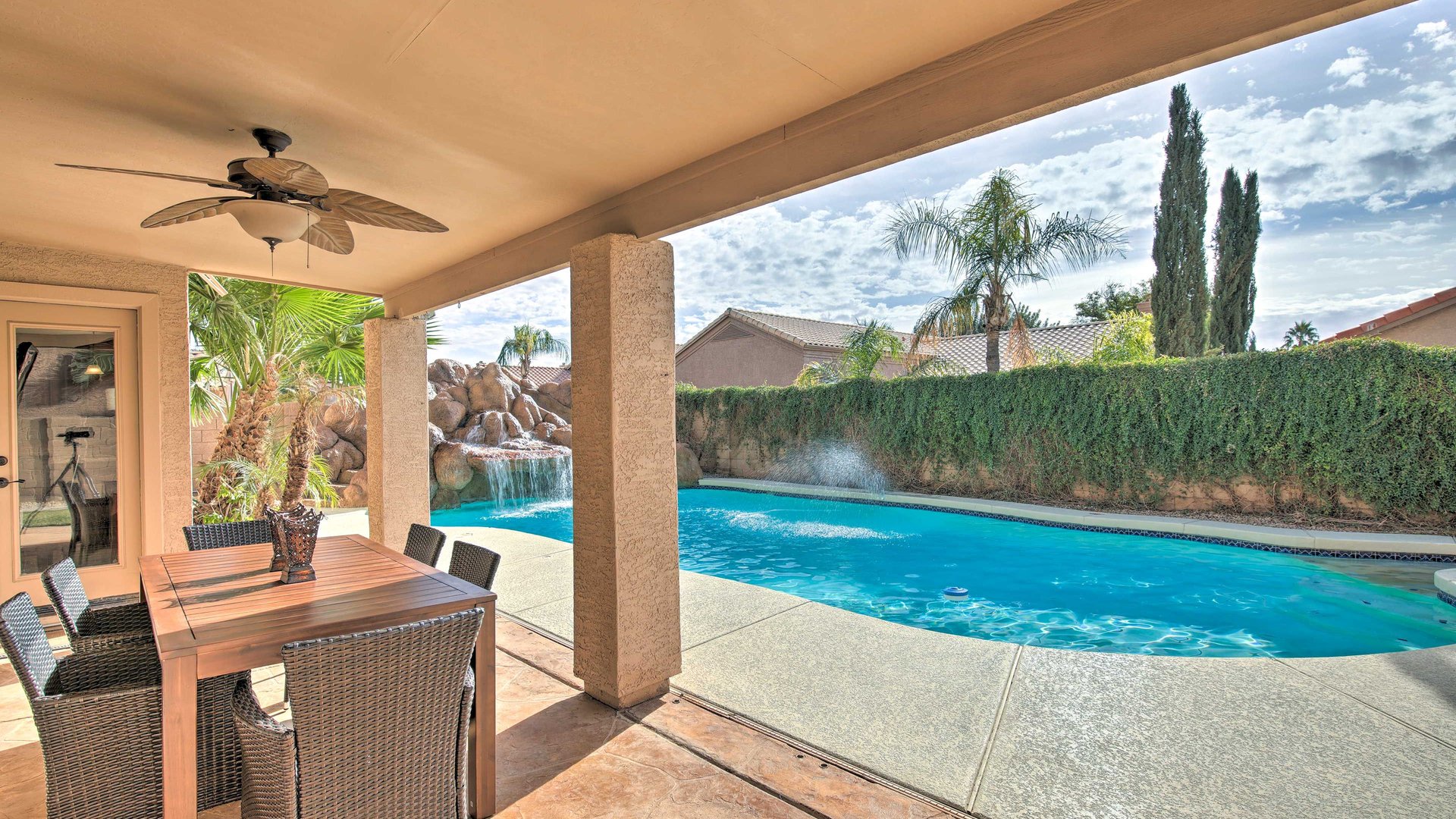 Relax at your covered patio with dining table overlooking the sparkling pool