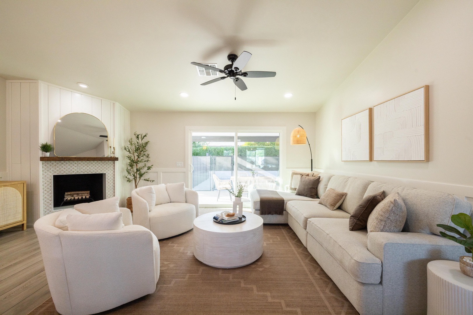 Spacious, light-filled living room with direct patio access - indoor-outdoor living at its finest