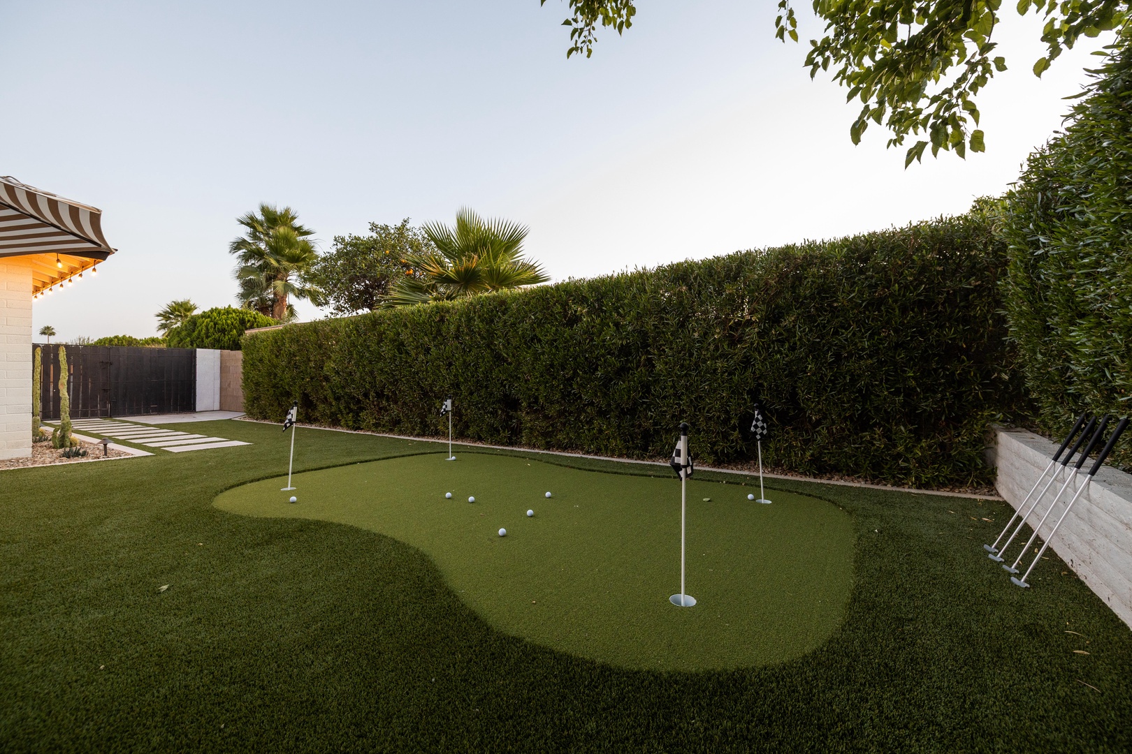 Private 4-hole putting green with putters included. Fore!