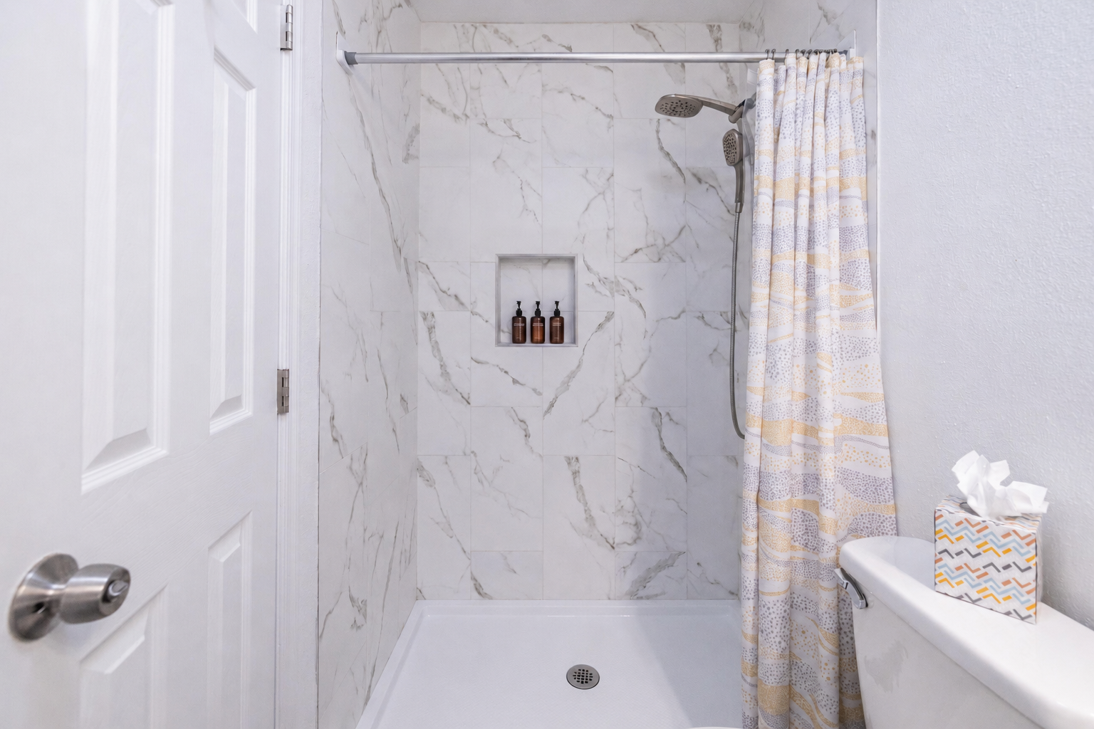 Start the day refreshed in this updated master ensuite walk-in shower.