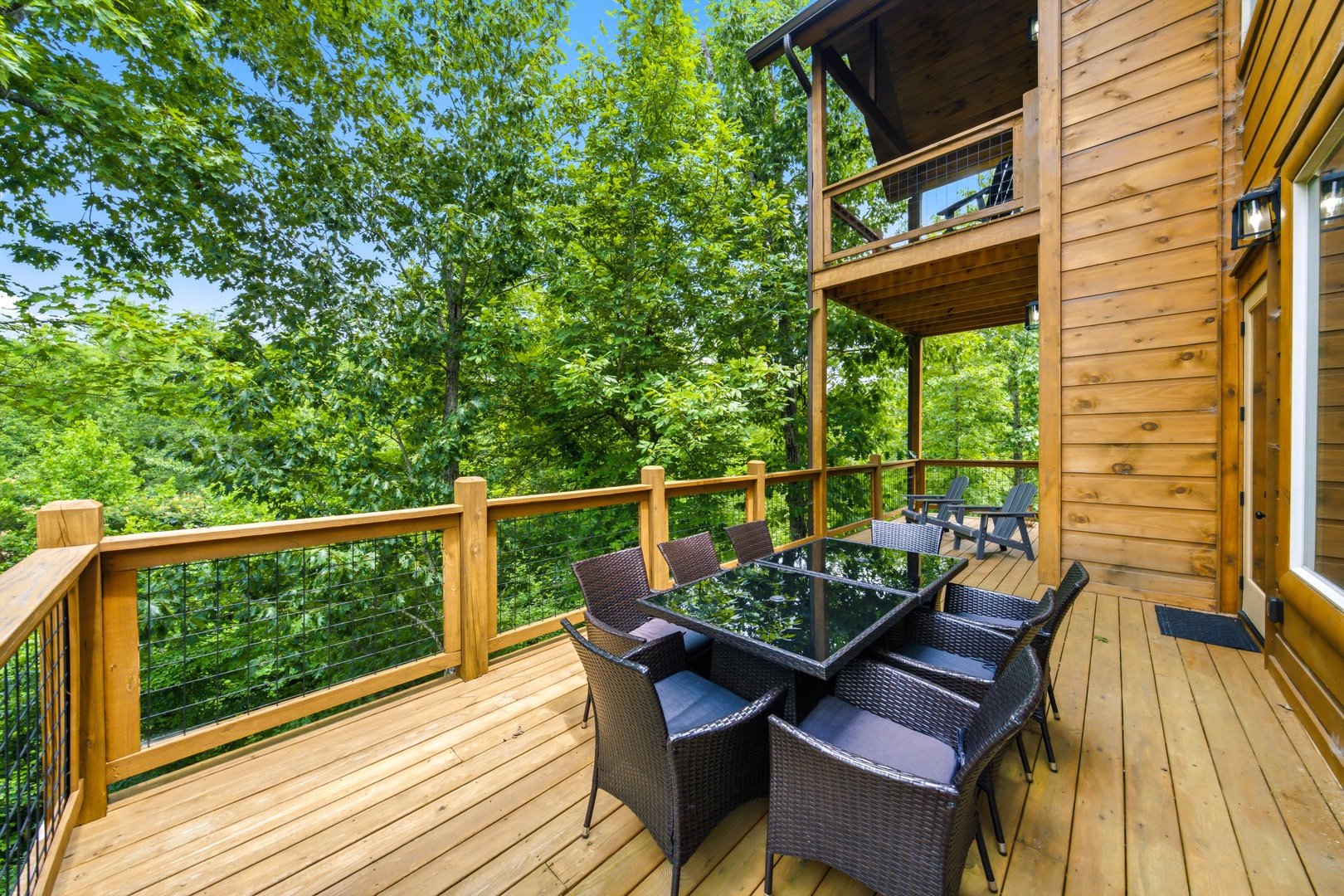 Scenic deck with views nestled in lush greenery, perfect for morning coffee or evening dinners under the trees.