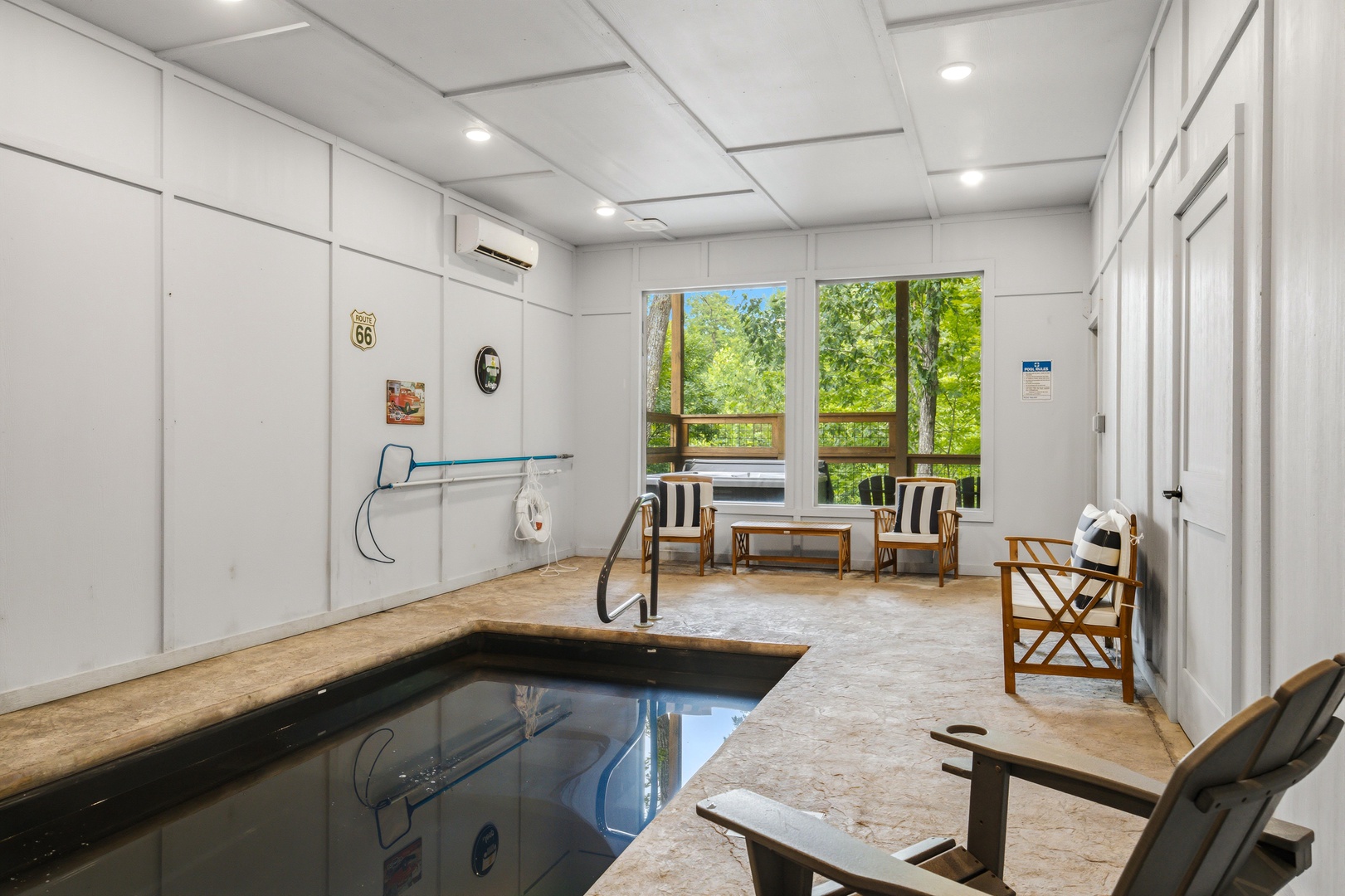 Step into your personal retreat with a refreshing indoor plunge pool and bright views of the surrounding forest, creating a relaxing, resort-like oasis just for you.