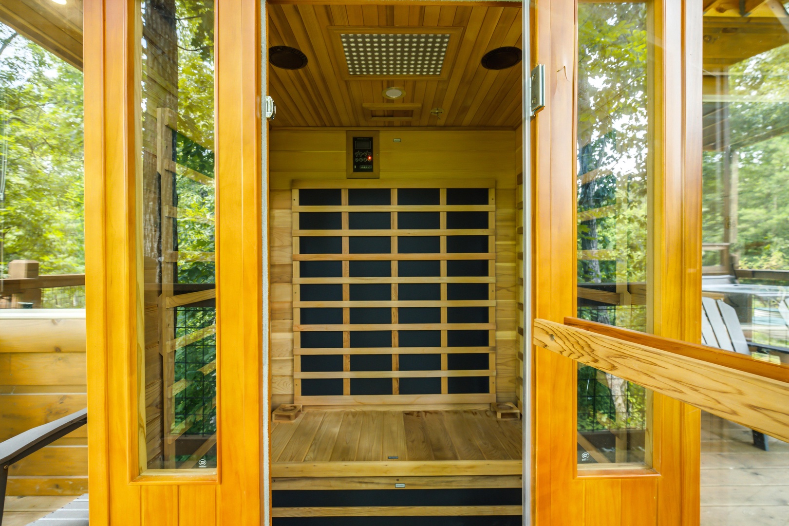 Step into your private infrared sauna surrounded by forest views, where natural wood and gentle heat invite you to unwind completely.