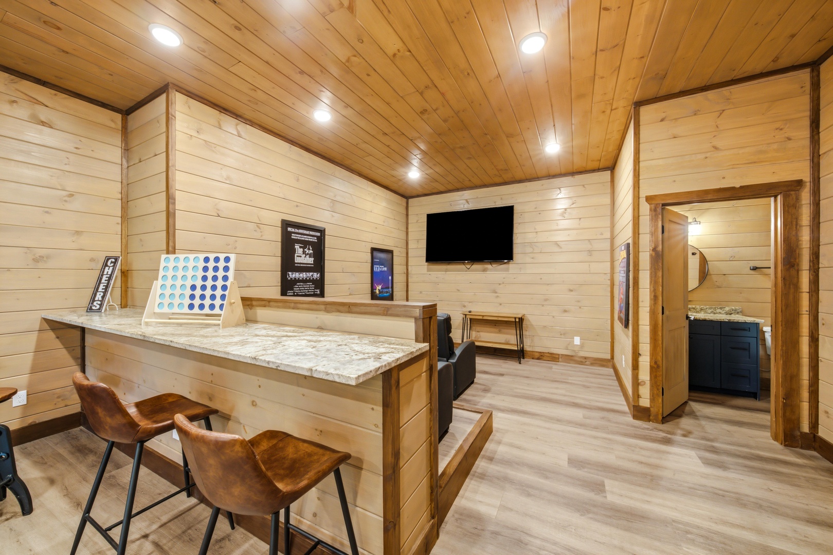 Enjoy your own private game room with a sleek bar, fun activities, and rustic charm perfect for evenings in.