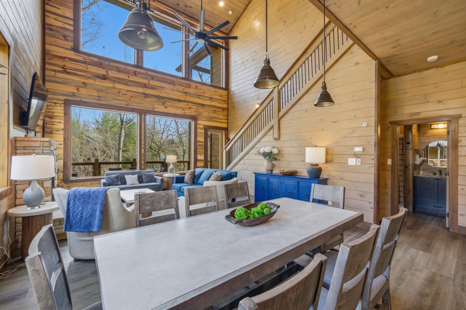 Relax in this stunning open-concept space where soaring wood ceilings and cozy furnishings create your perfect mountain retreat.