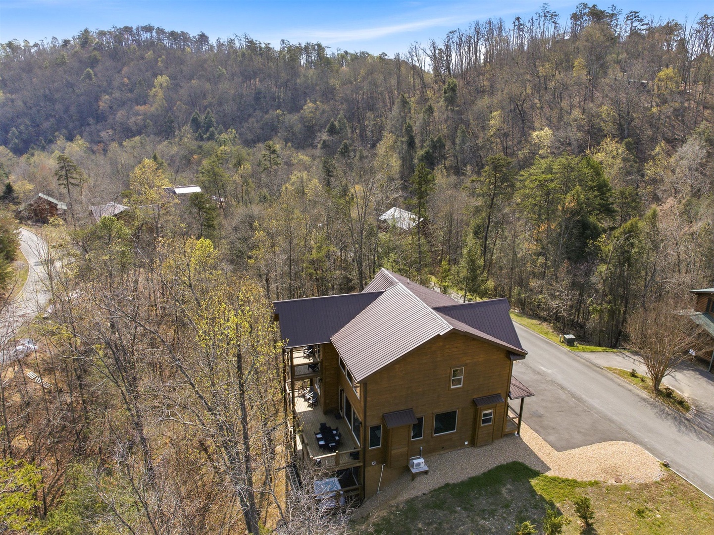 Mountain retreat nestled among rolling wooded hills with scenic valley views and peaceful natural surroundings.