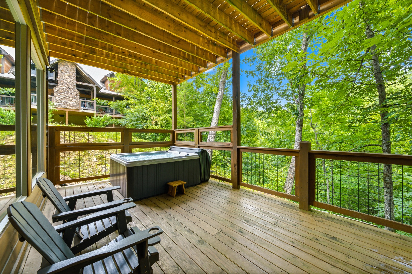 Soak in your private hot tub while taking in lush forest views from your secluded deck. Fresh mountain air and peaceful treetop scenery create the perfect escape.