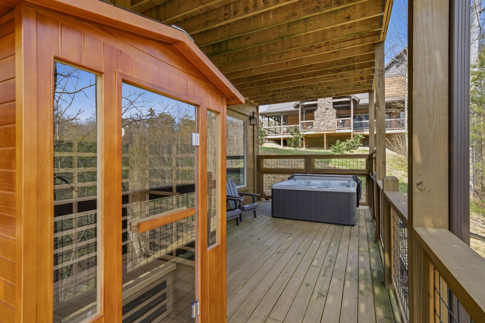 Unwind in your private hot tub on the covered deck, surrounded by tranquil forest views and mountain scenery.