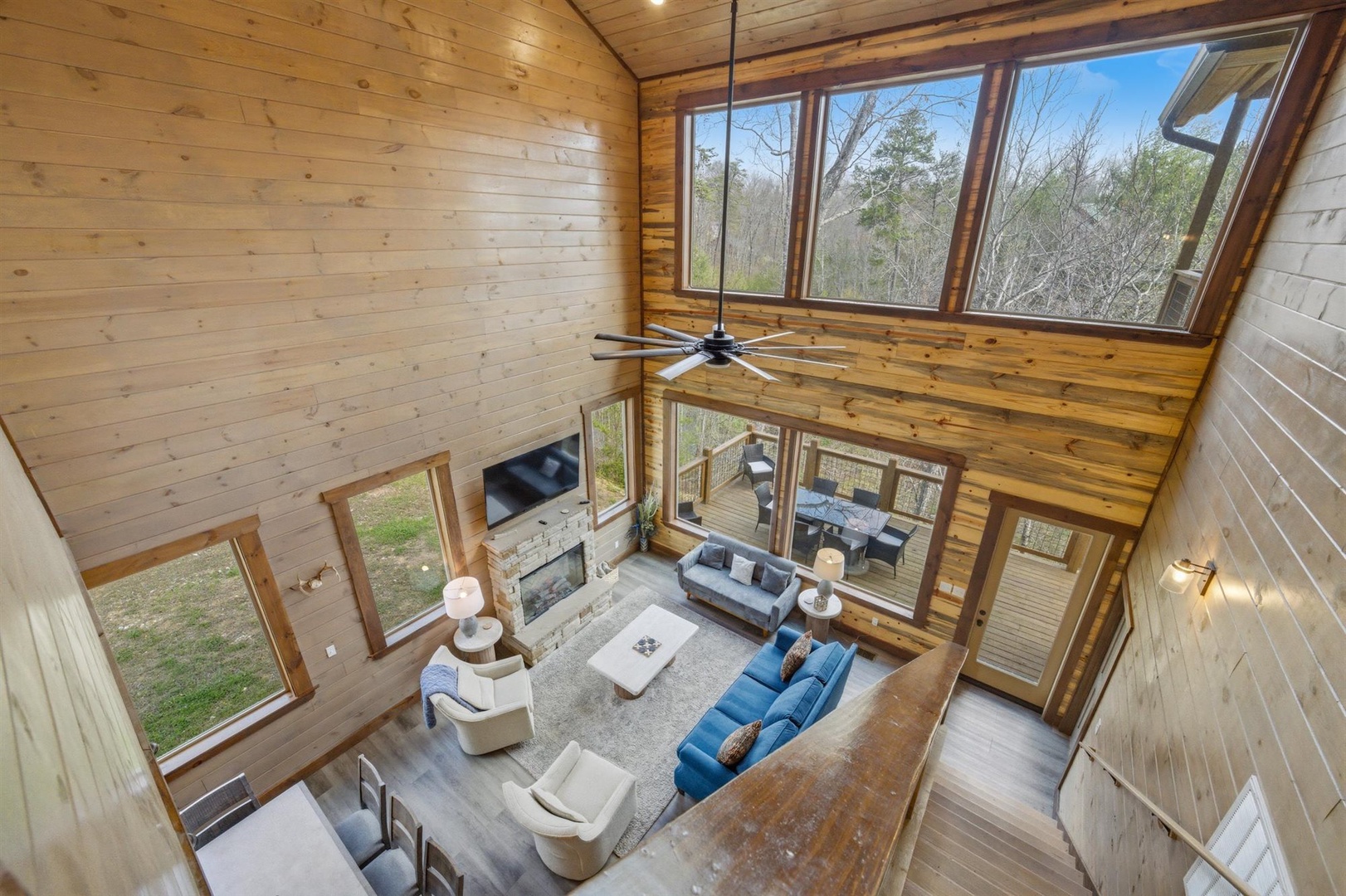 Soaring ceilings and walls of windows fill your living space with natural light and stunning forest views.