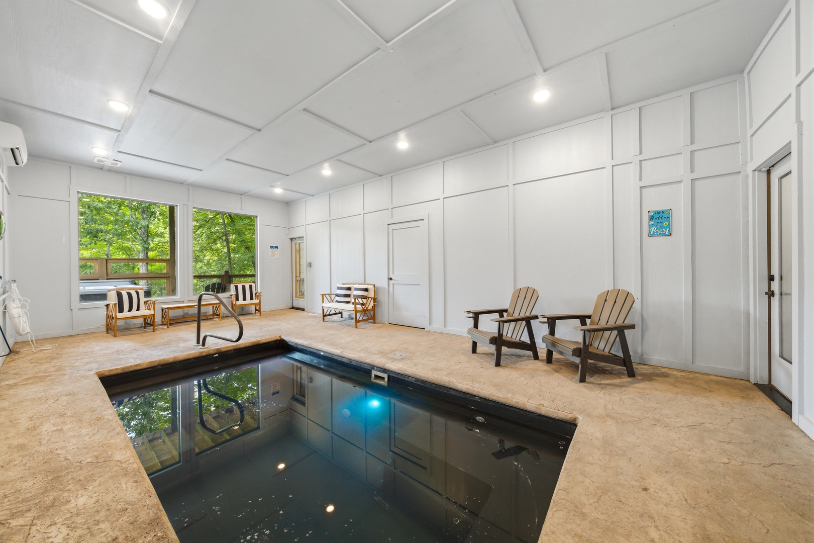 Slip into your private indoor pool and feel the day's cares melt away. Sleek modern design meets total relaxation, with ample seating and garden views for your perfect escape.