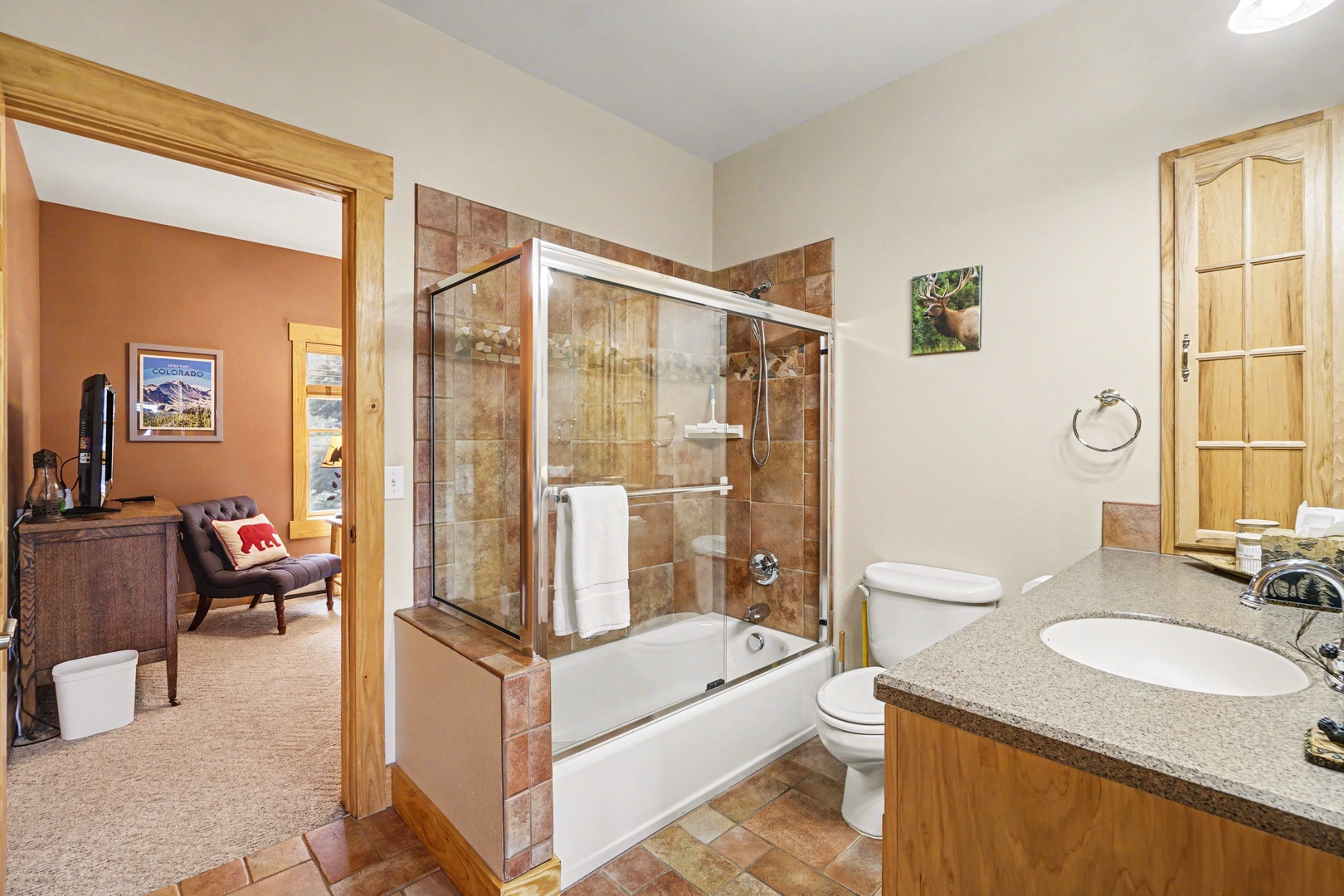 Unwind in your spacious bathroom featuring a beautiful tiled shower-tub combo.