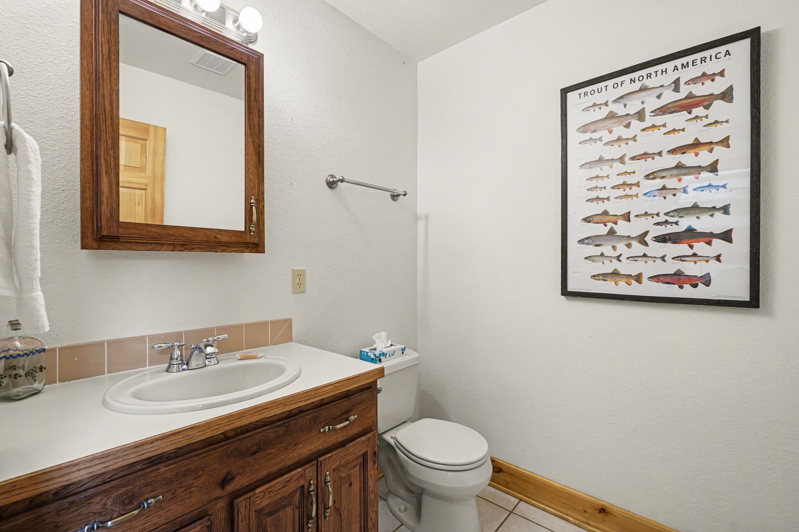 Freshen up in your charming bathroom with rustic wood vanity and thoughtful touches that make your stay feel like home.