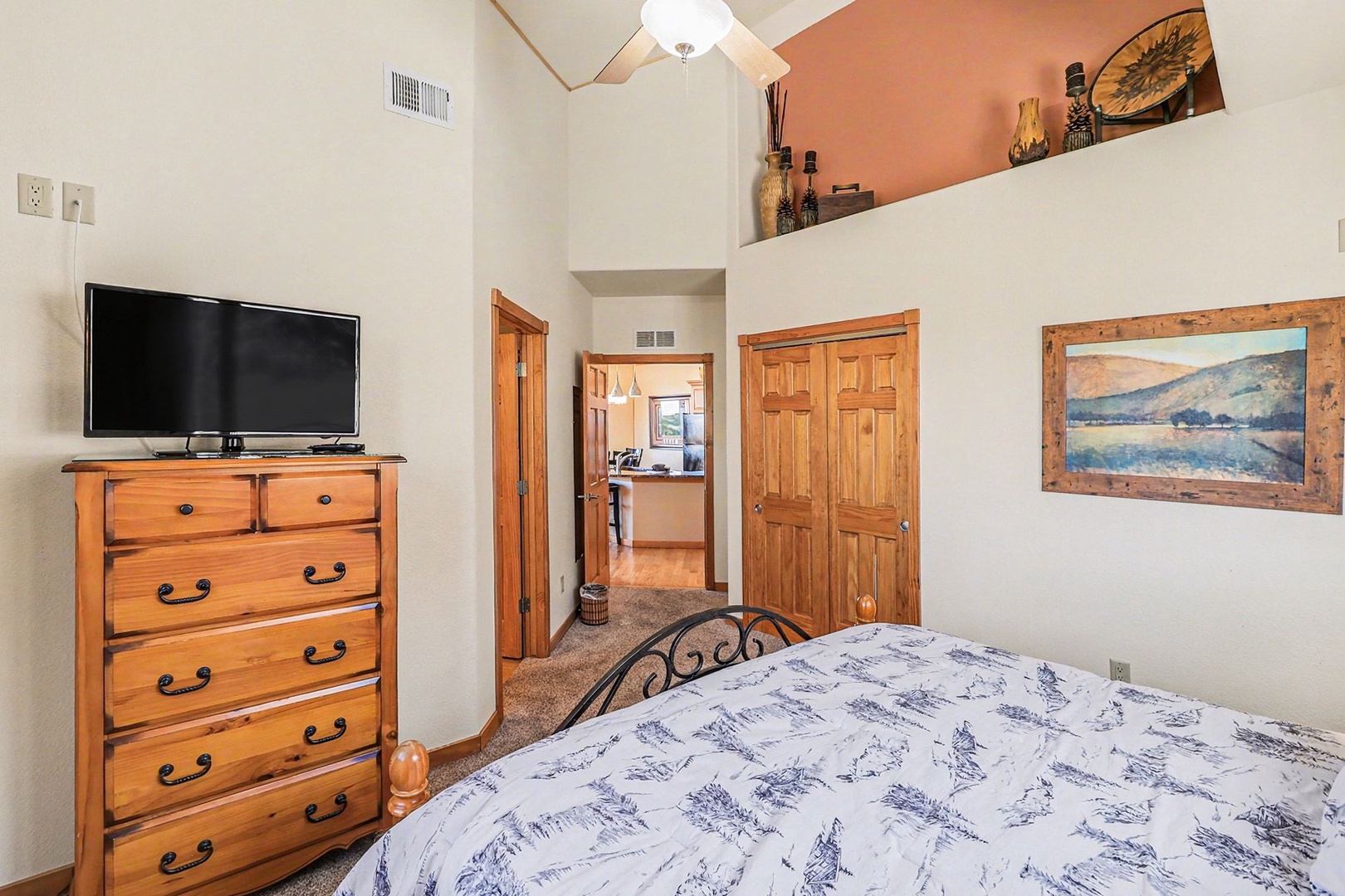 Your cozy king bedroom features a comfortable bed, spacious closet and dresser, and flat-screen TV for relaxing evenings after your adventures.