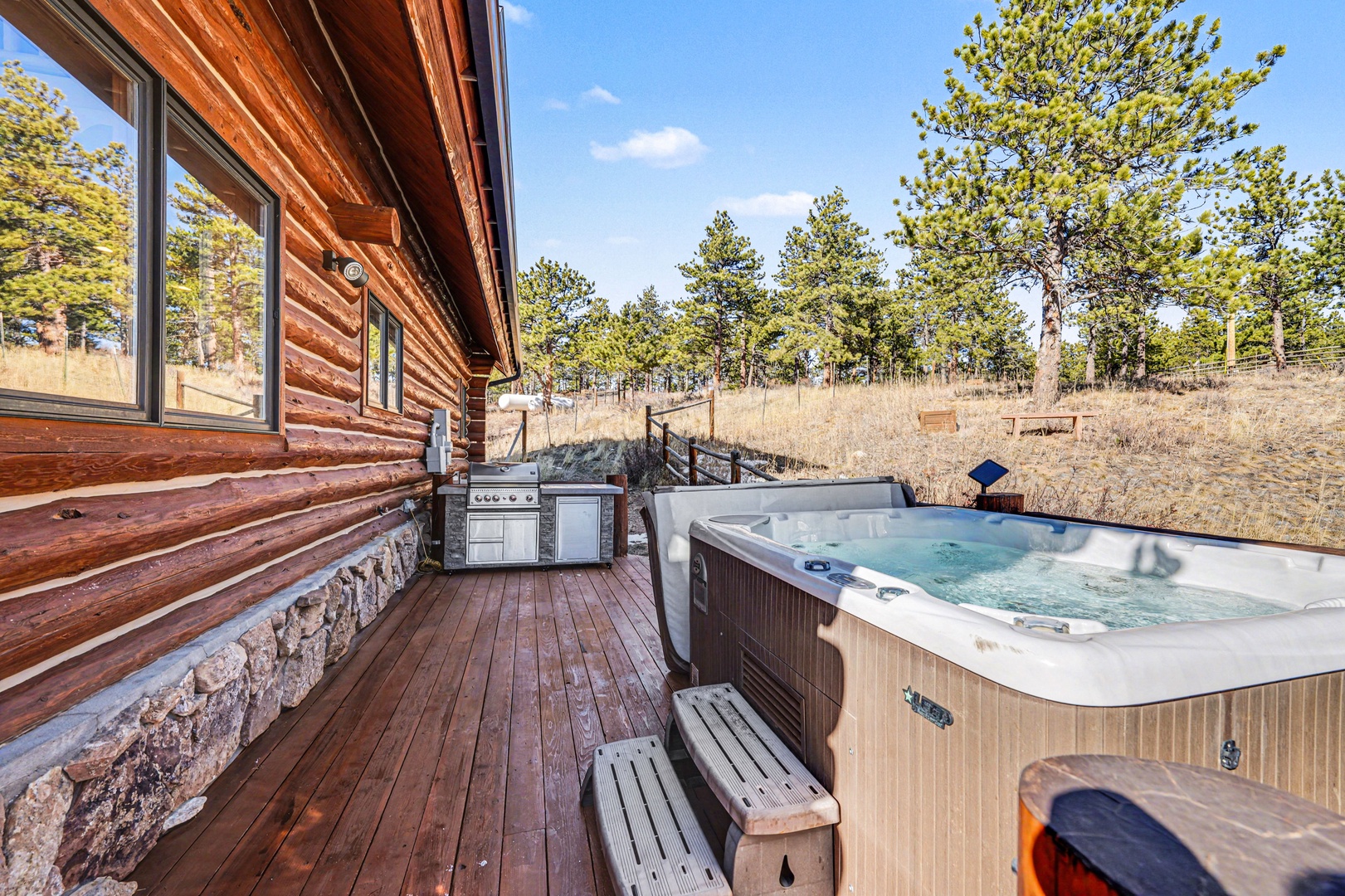 Soak in your private hot tub on this beautiful deck, surrounded by peaceful mountain views and fresh air.