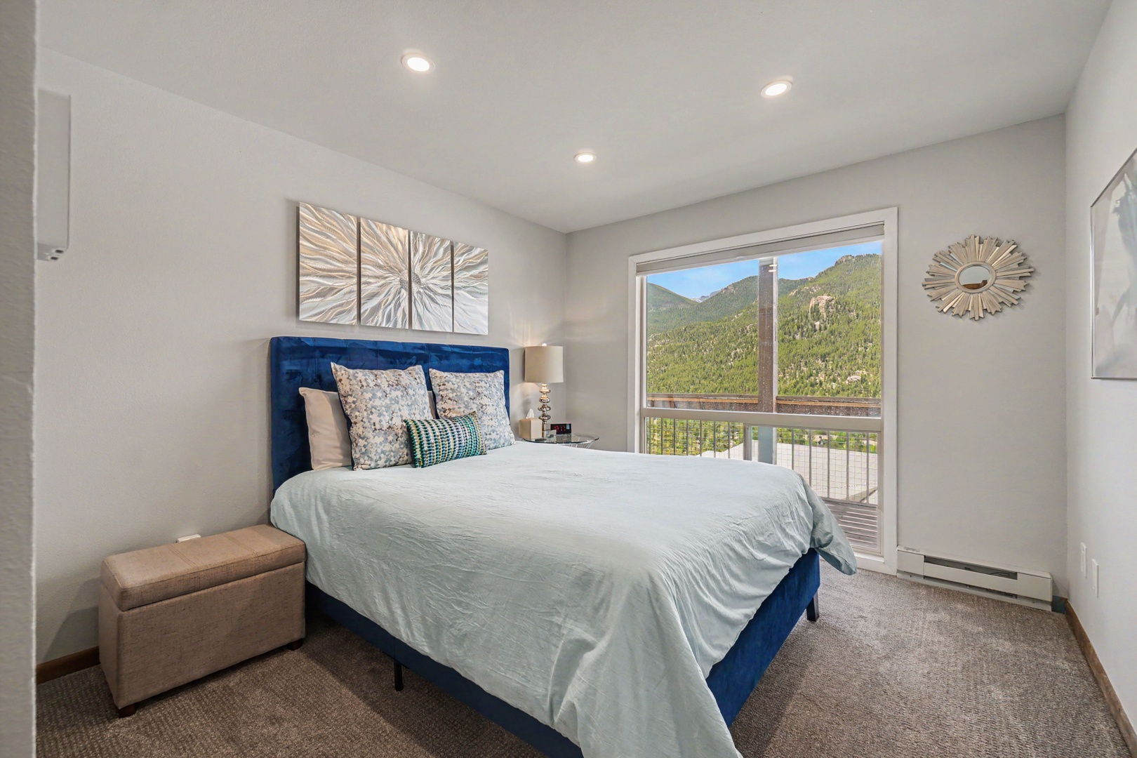 Wake up to breathtaking mountain vistas framing your relaxing Queen bedroom retreat.