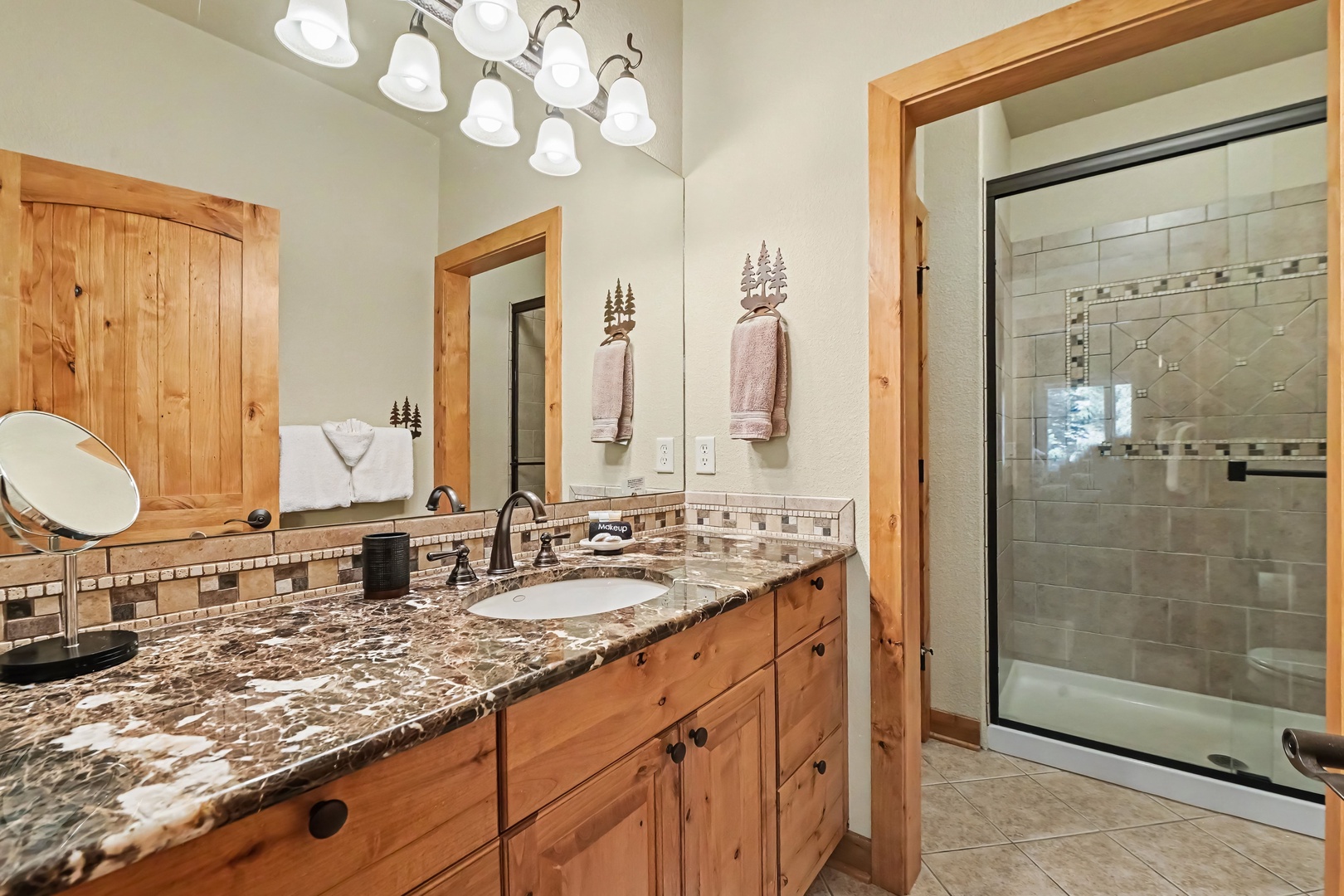 Master bathroom with large walk-in shower. A pocket door separates the shower from the vanity area.