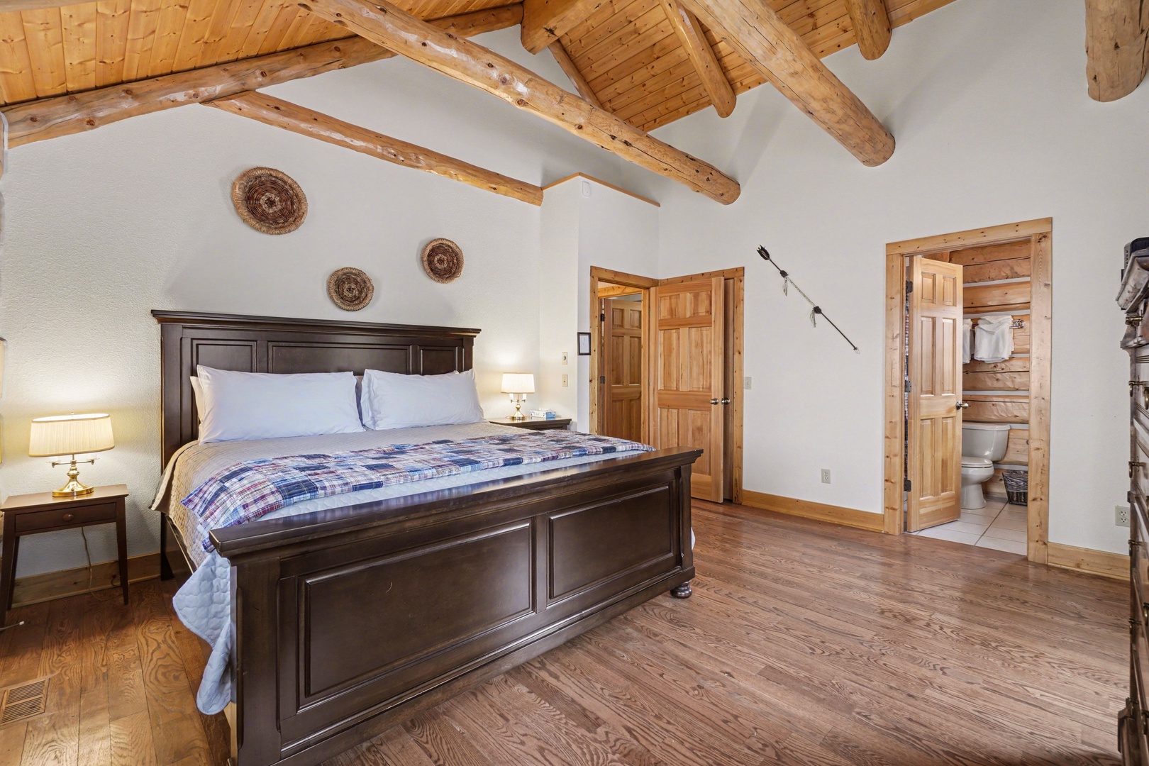Unwind in your charming rustic bedroom with exposed beams and an en-suite bathroom for ultimate comfort.