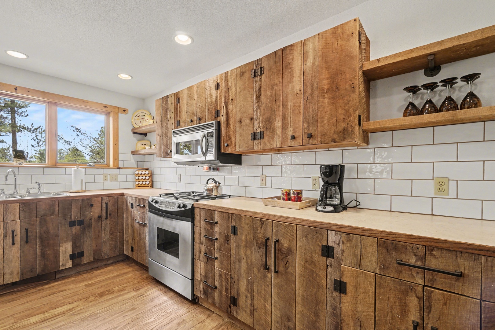 Rustic wood cabinets and modern appliances create the perfect mountain kitchen for your culinary adventures.