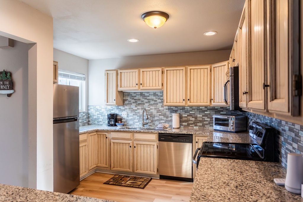 Your fully equipped kitchen awaits with granite counters, stainless appliances, and everything you need to create memorable meals during your stay.