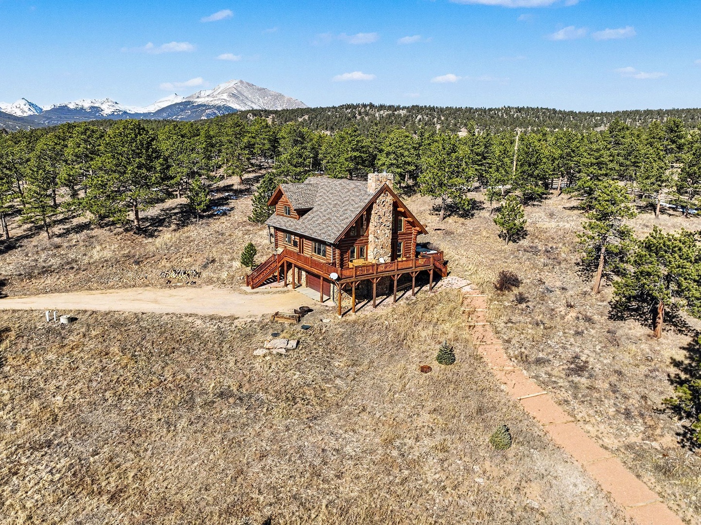 This beautiful log home is surrounded by the Rocky Mountains!