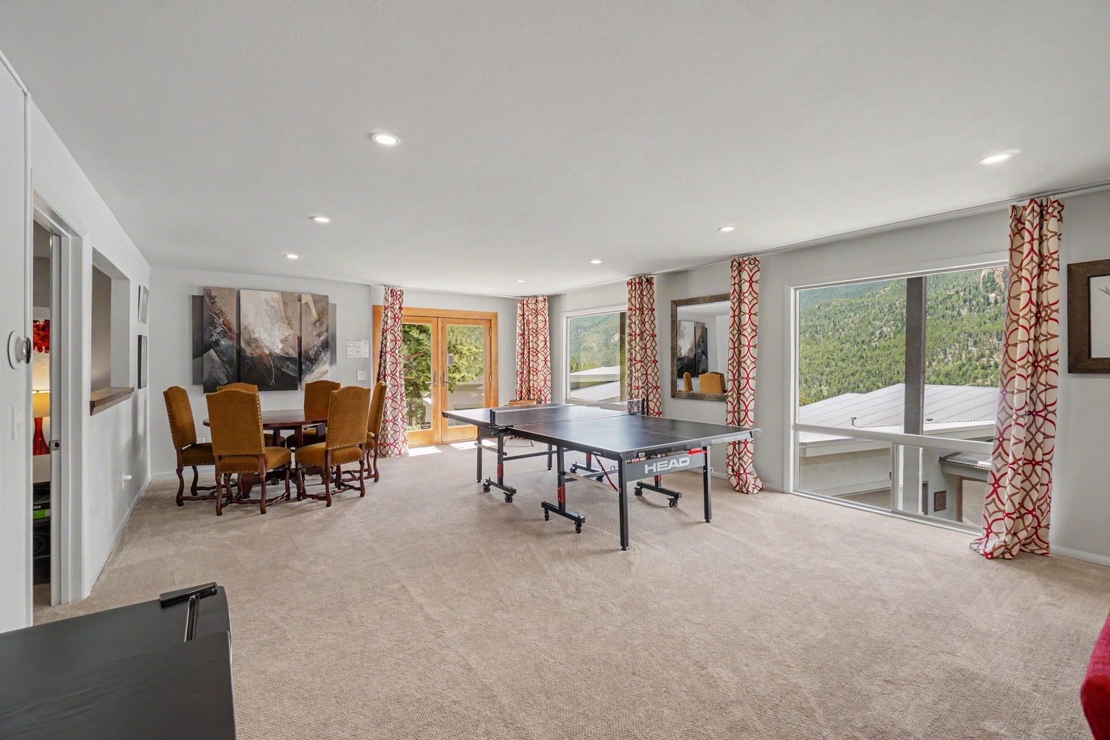 Your spacious lower level game room with ping pong table, and game table.