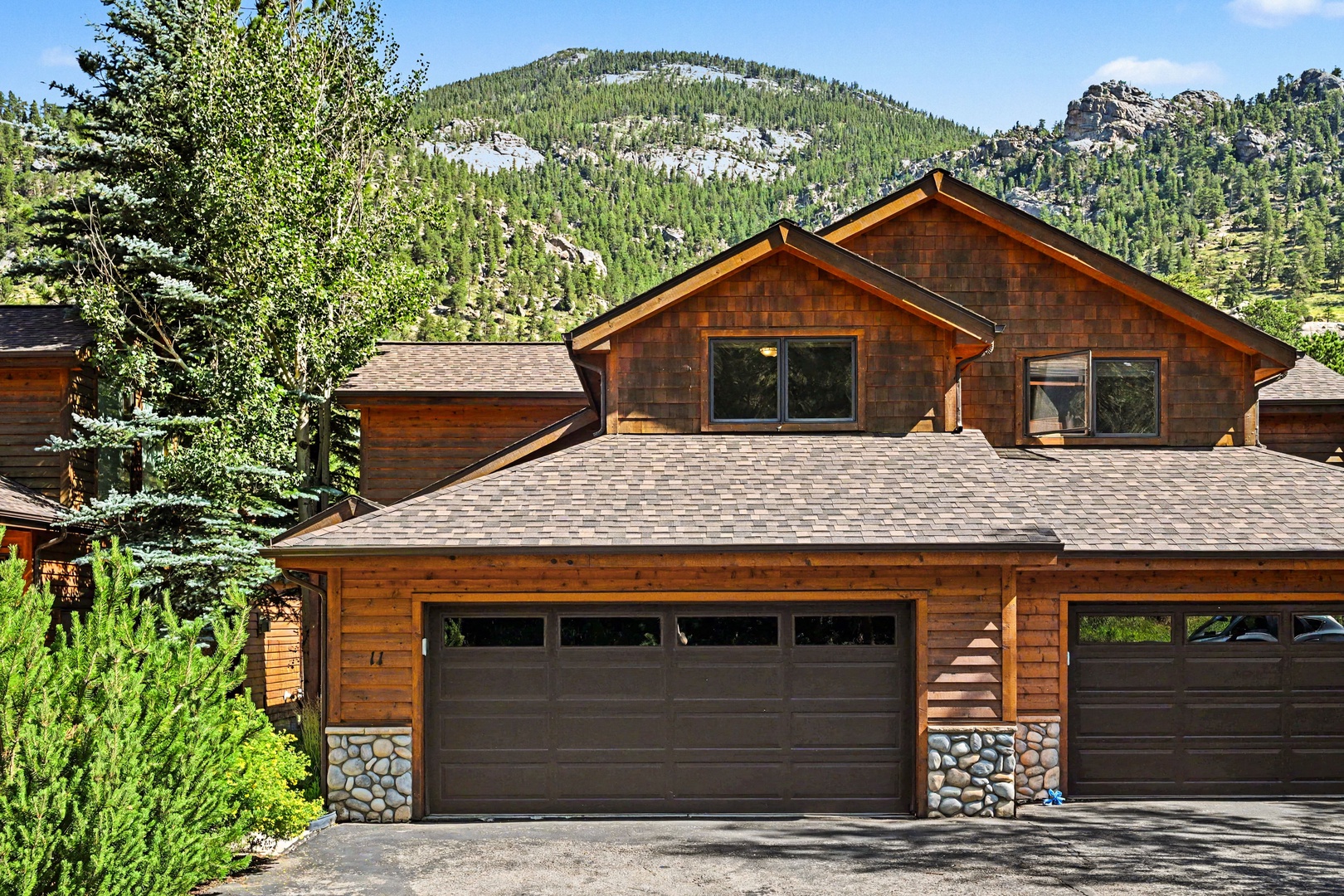 Garage, parking for two cars in the driveway.
