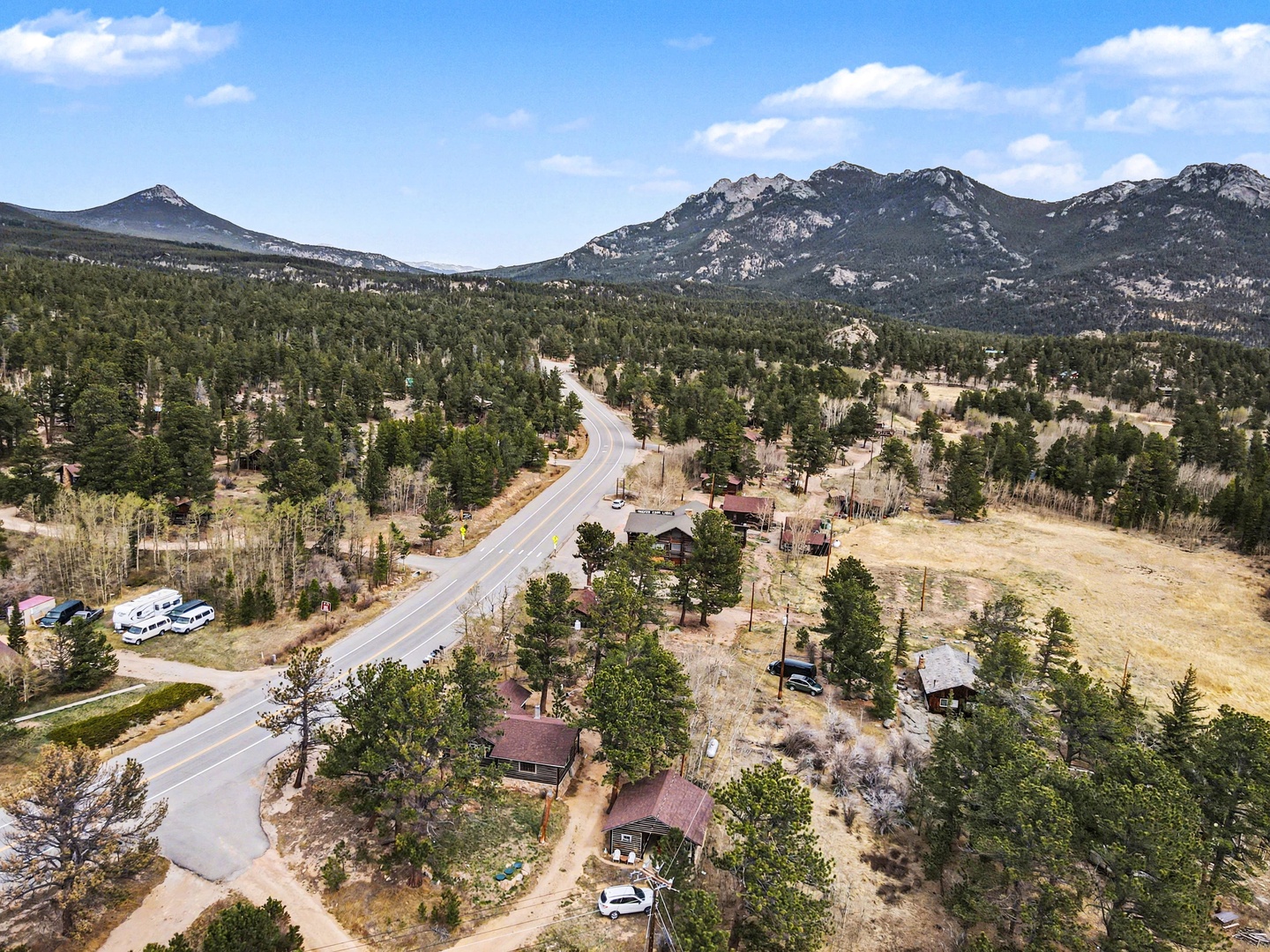 Scenic mountain community surrounded by forested peaks and natural landscape, offering a peaceful retreat setting.