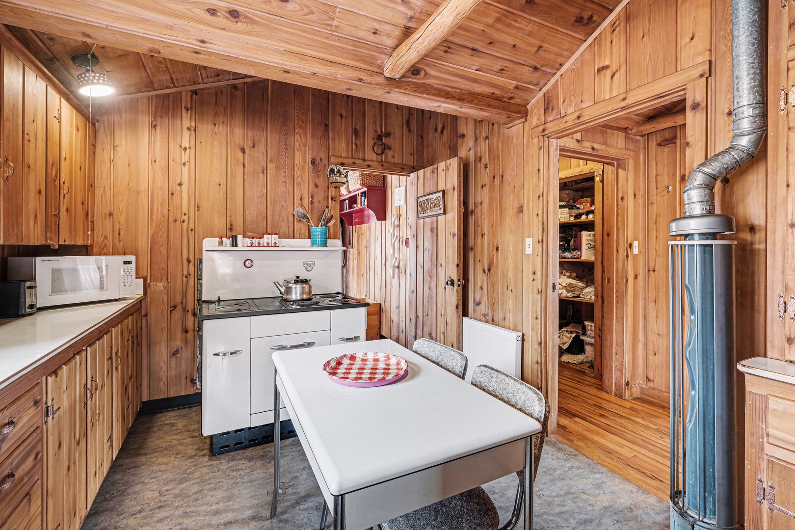 Cozy kitchen with antique stove/oven where you'll create mountain memories.