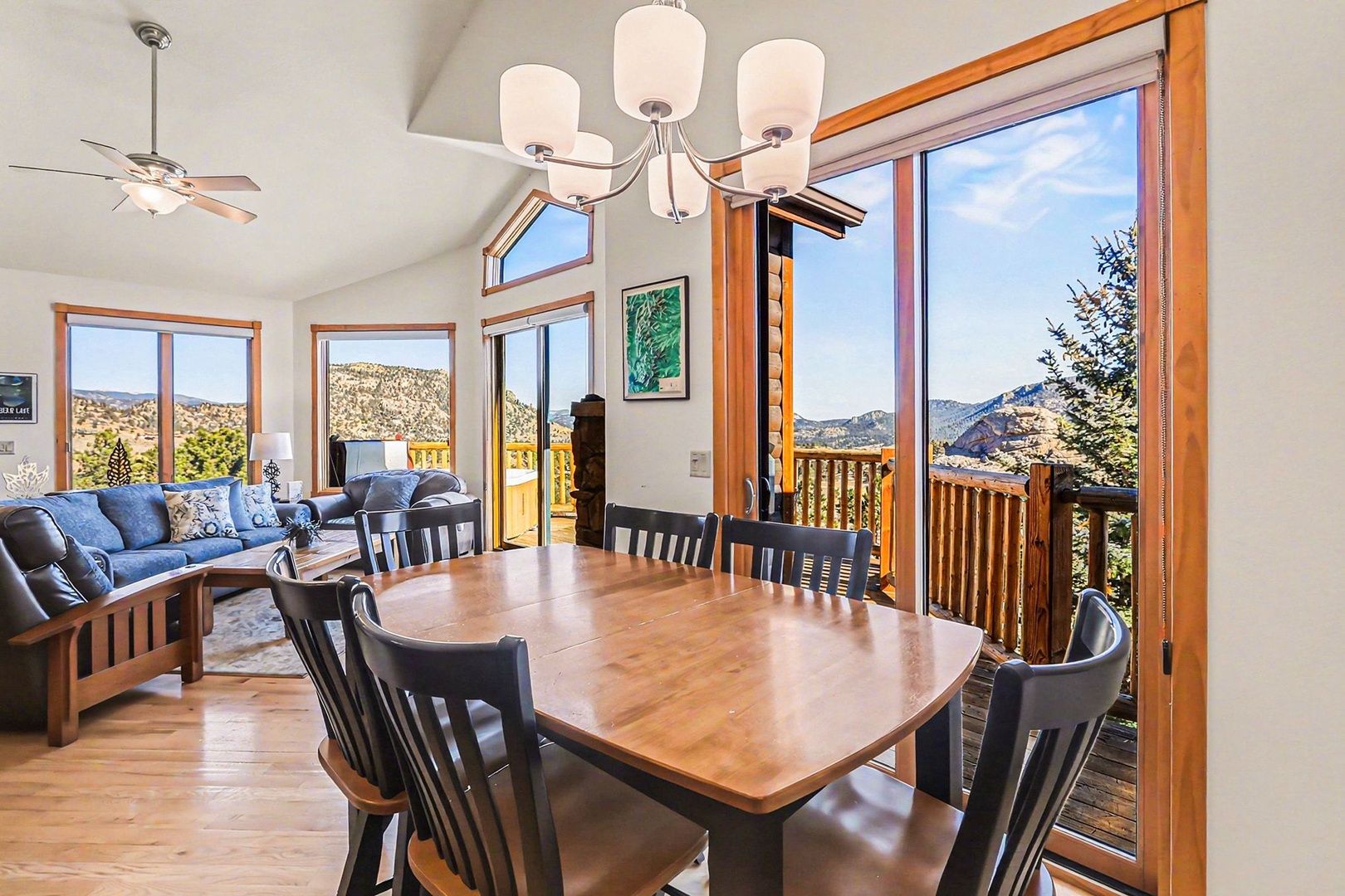 Gather around your comfortable dining table while soaking in breathtaking mountain vistas through floor-to-ceiling windows that frame nature's masterpiece.