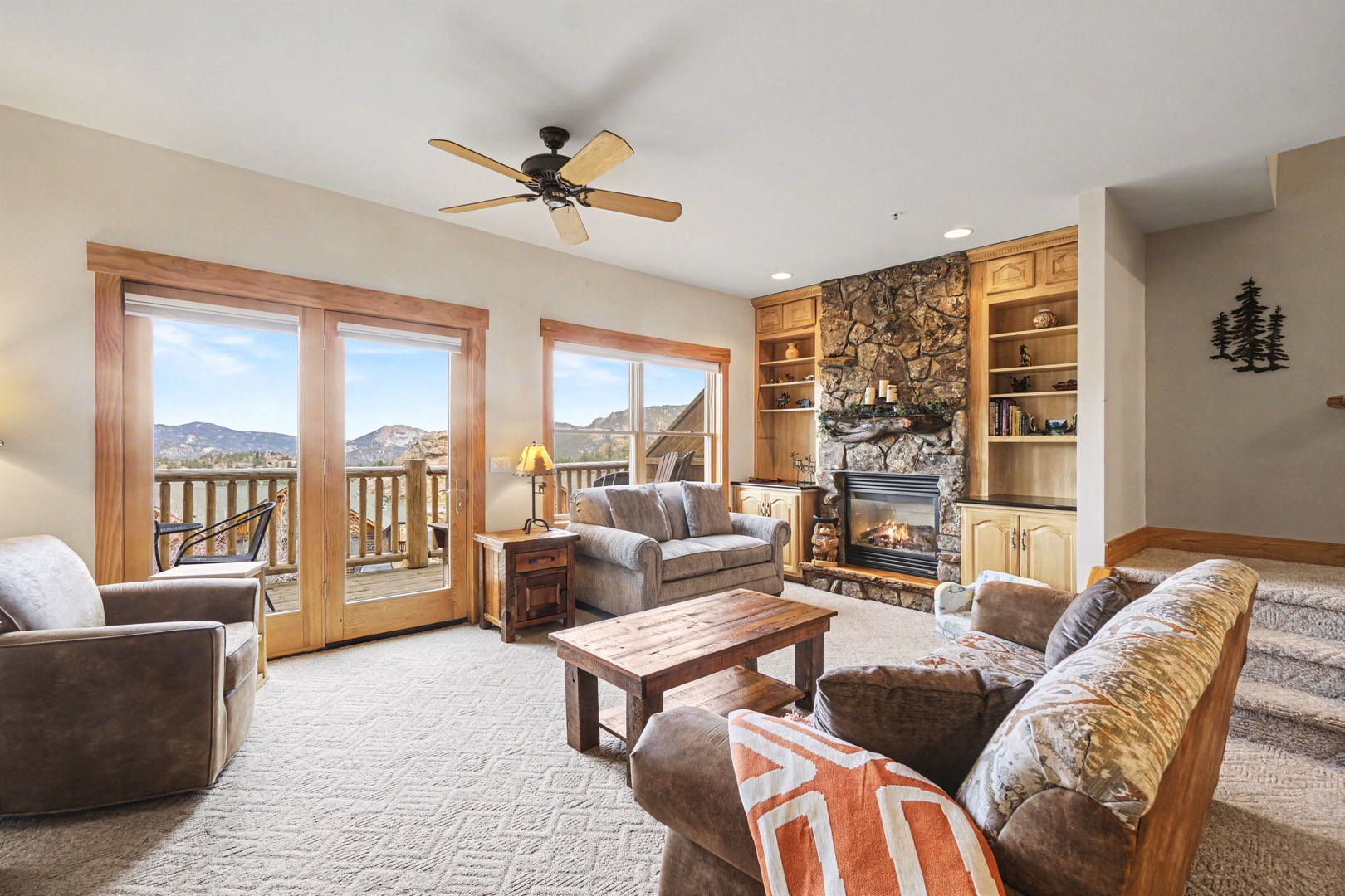 Sink into plush seating by your stone fireplace while mountain views stretch beyond French doors to your private balcony.