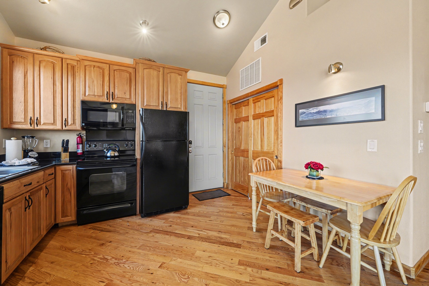 Enter through the keyless entry front door into the fully equipped kitchen.