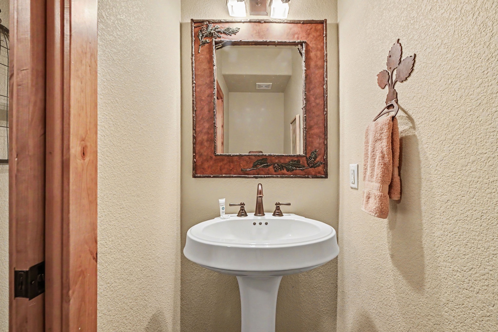 Convenient powder room in main level hallway