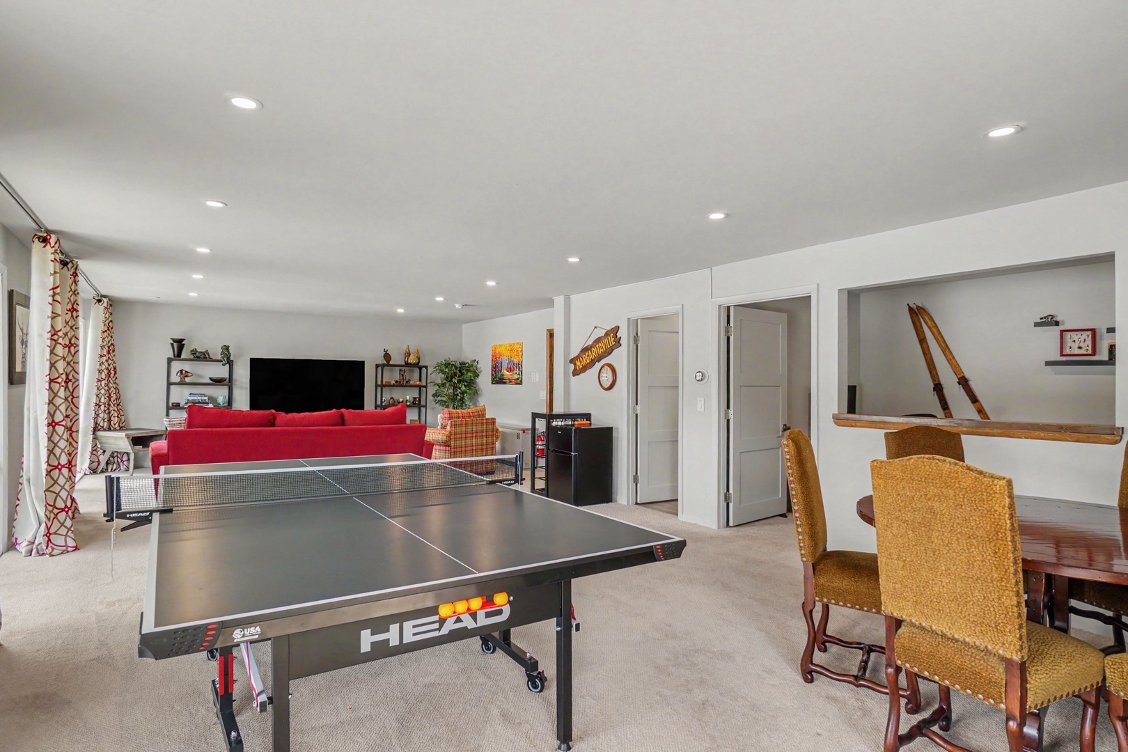 Enjoy your own private game room featuring ping pong table, game table and cozy lounge area with Smart TV.