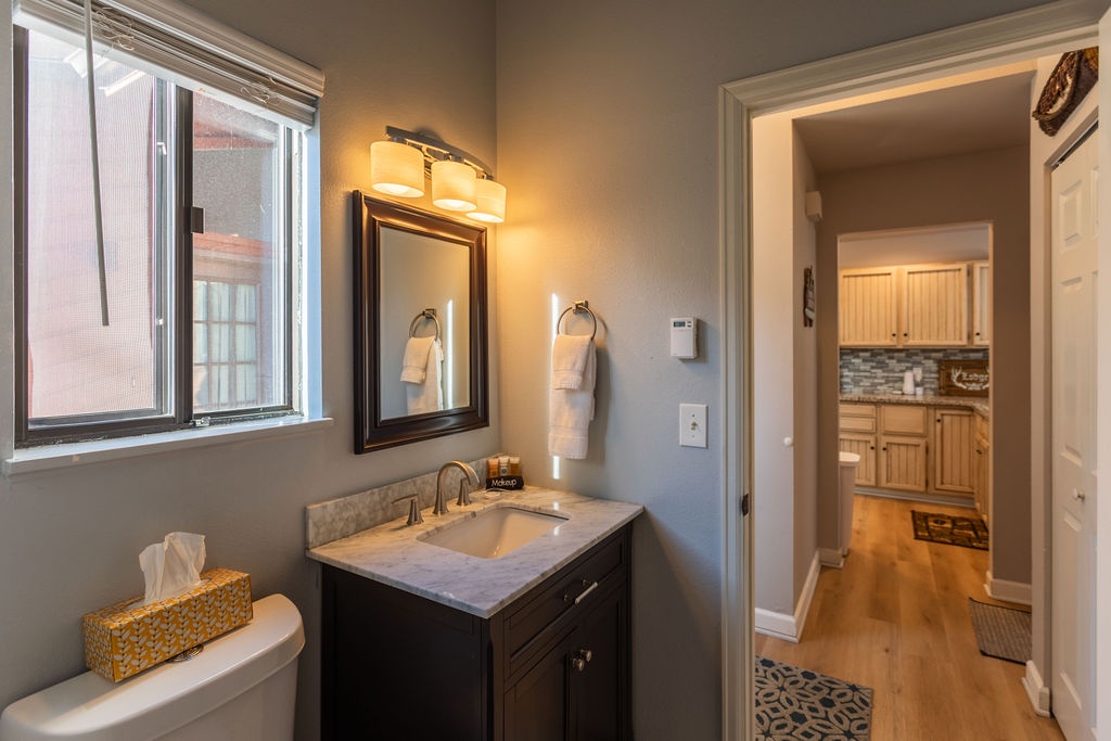 Your cute lower level half bath with laundry.