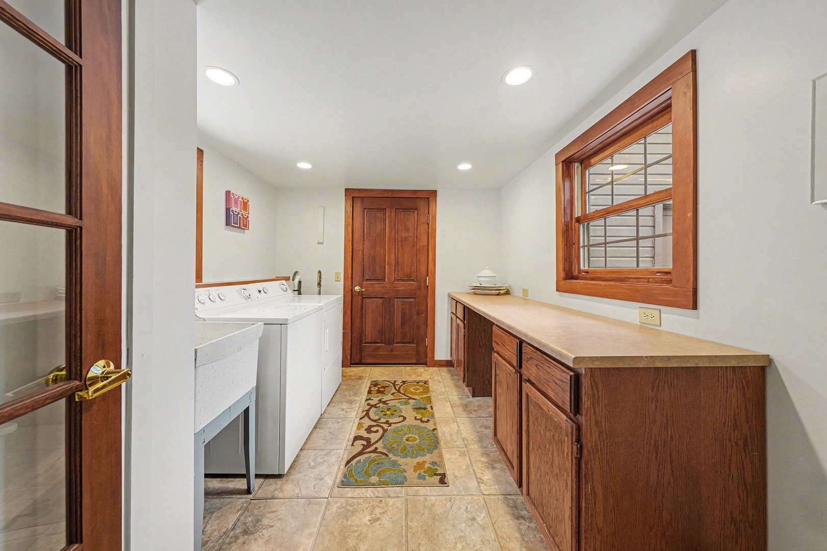 Your dedicated laundry room features modern appliances and abundant counter space for folding, making keeping your vacation wardrobe fresh effortless.