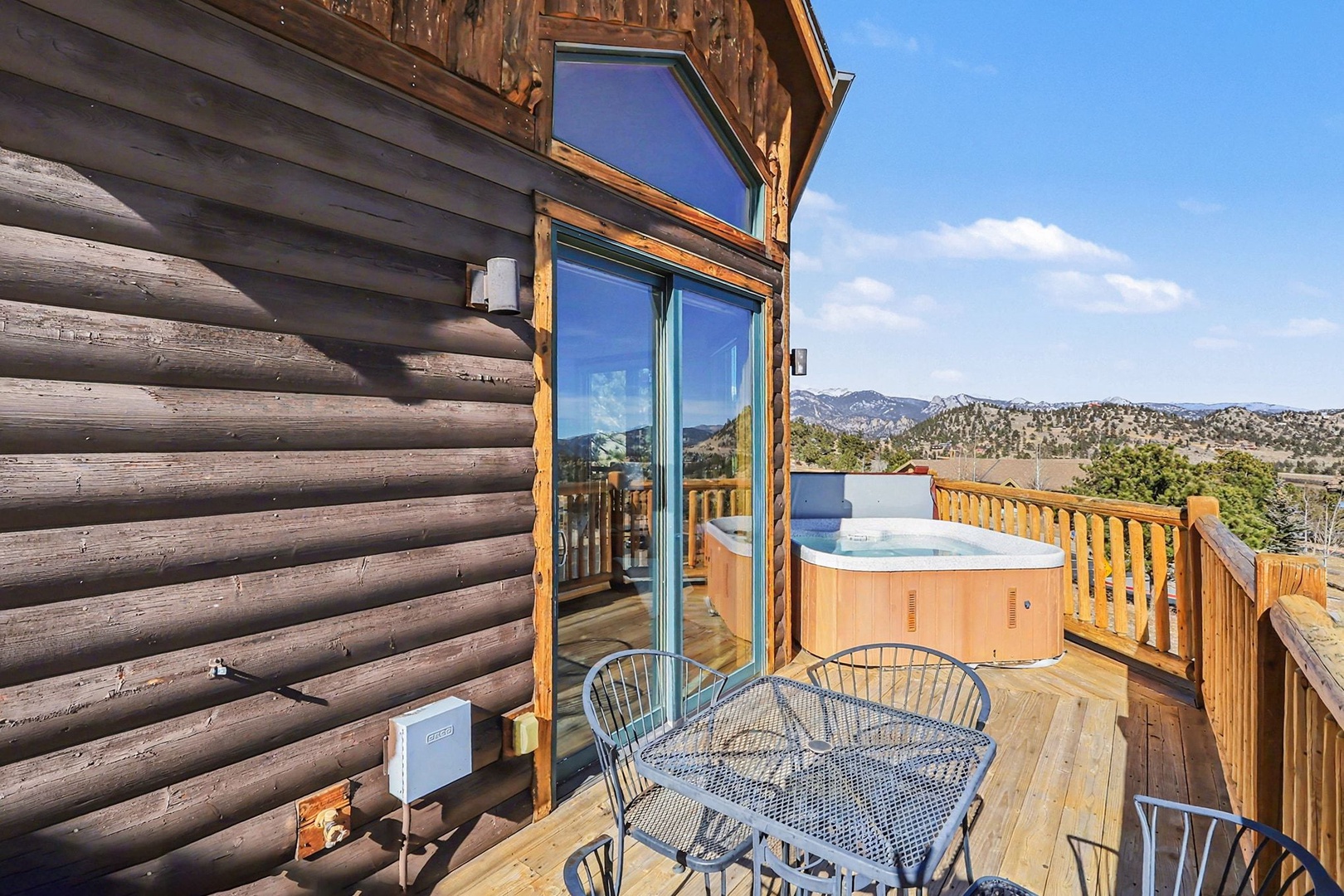 Soak in your private hot tub while gazing at breathtaking mountain views from this elevated deck sanctuary.