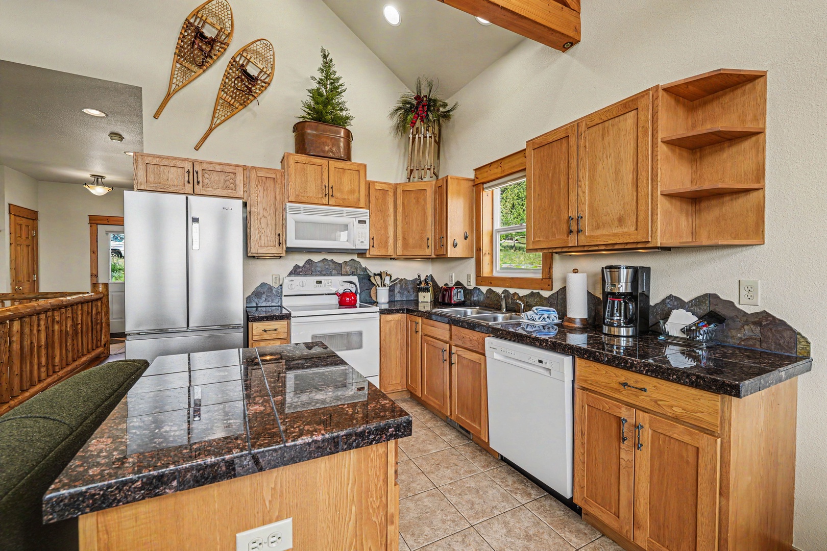 Step into your fully equipped mountain kitchen with granite counters, modern appliances, and charming lodge décor—where cozy meets convenience for your alpine getaway.