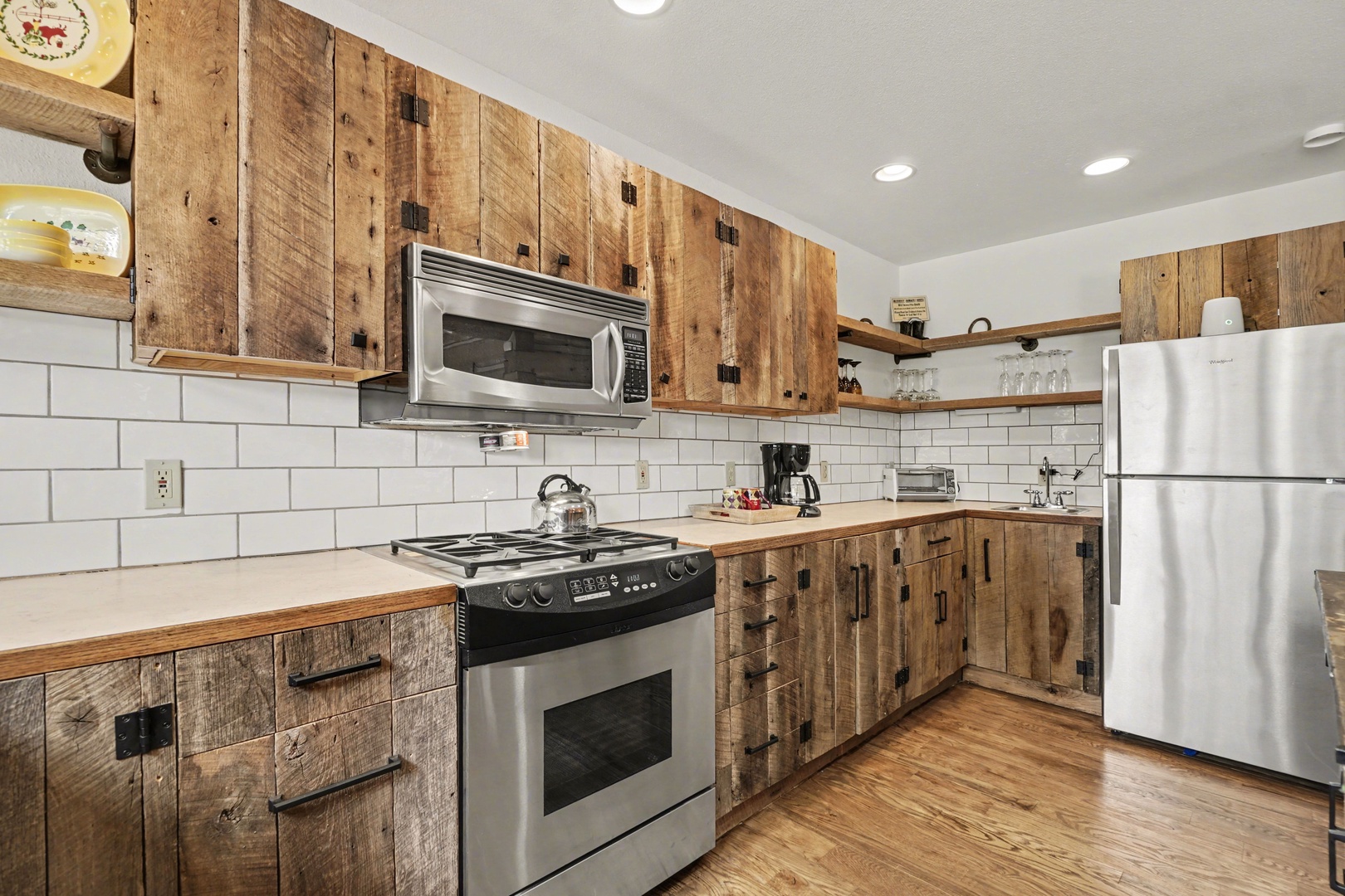 Your spacious rustic kitchen features handcrafted wooden cabinets, modern appliances, and everything needed for memorable home-cooked meals during your stay.