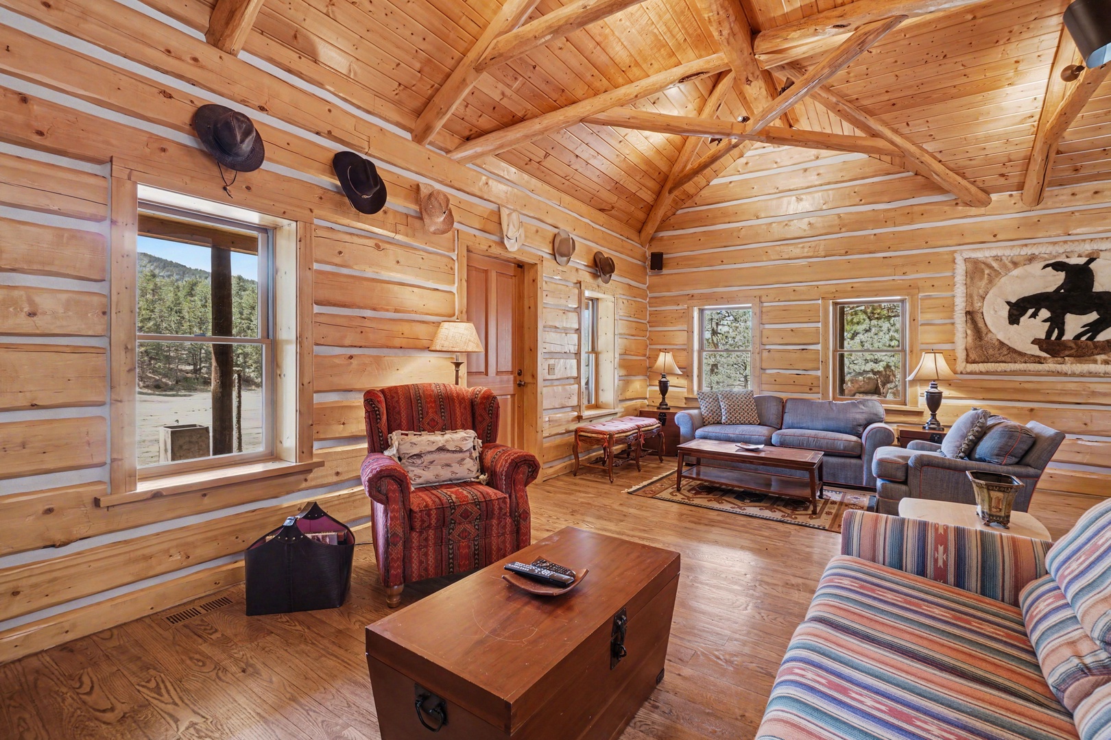 Step into your cozy log cabin retreat where exposed beams and rustic charm create the perfect atmosphere for relaxation.