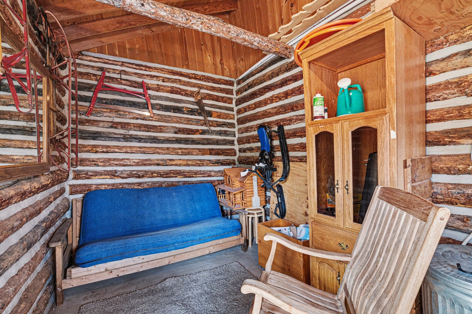 Unwind in the quaint sitting room located in the outbuilding next to the covered porch.