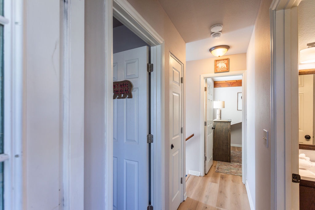 Your charming hallway connects all the comfortable spaces, with warm lighting and thoughtful details creating a welcoming home-away-from-home atmosphere.