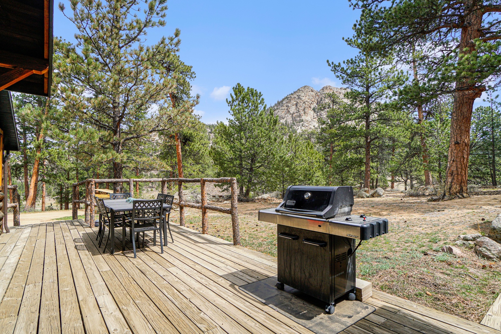 Breathe in mountain air while grilling on your private deck, surrounded by towering pines and dramatic rocky peaks.
