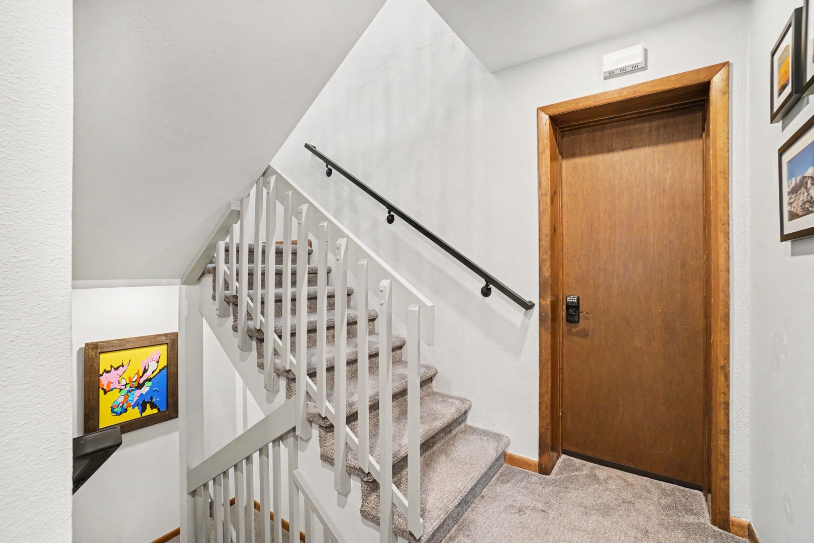 A second set of switchback stairs lead to the lower-level, where you'll find the recreation room.