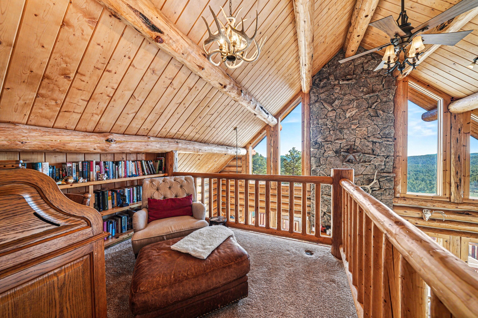 Curl up in your private mountain retreat loft, where rustic elegance meets comfort with sweeping forest views.