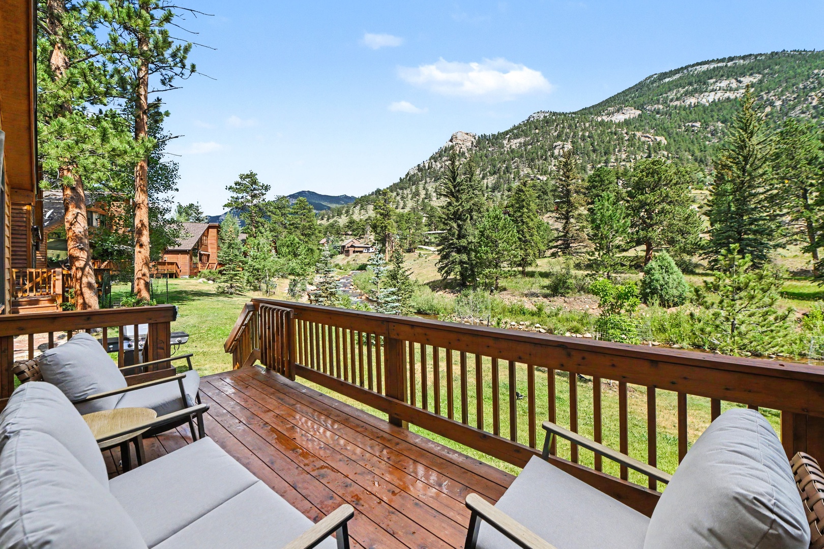 Private deck with plenty of seating overlooking the river.