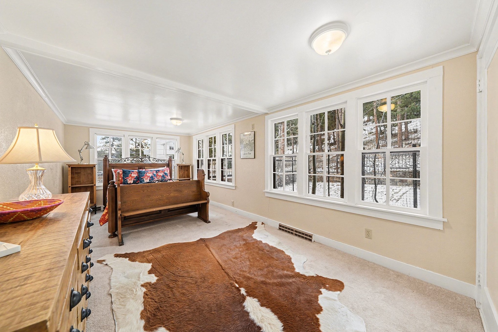 Twin Fawns first bedroom with windows facing the patio