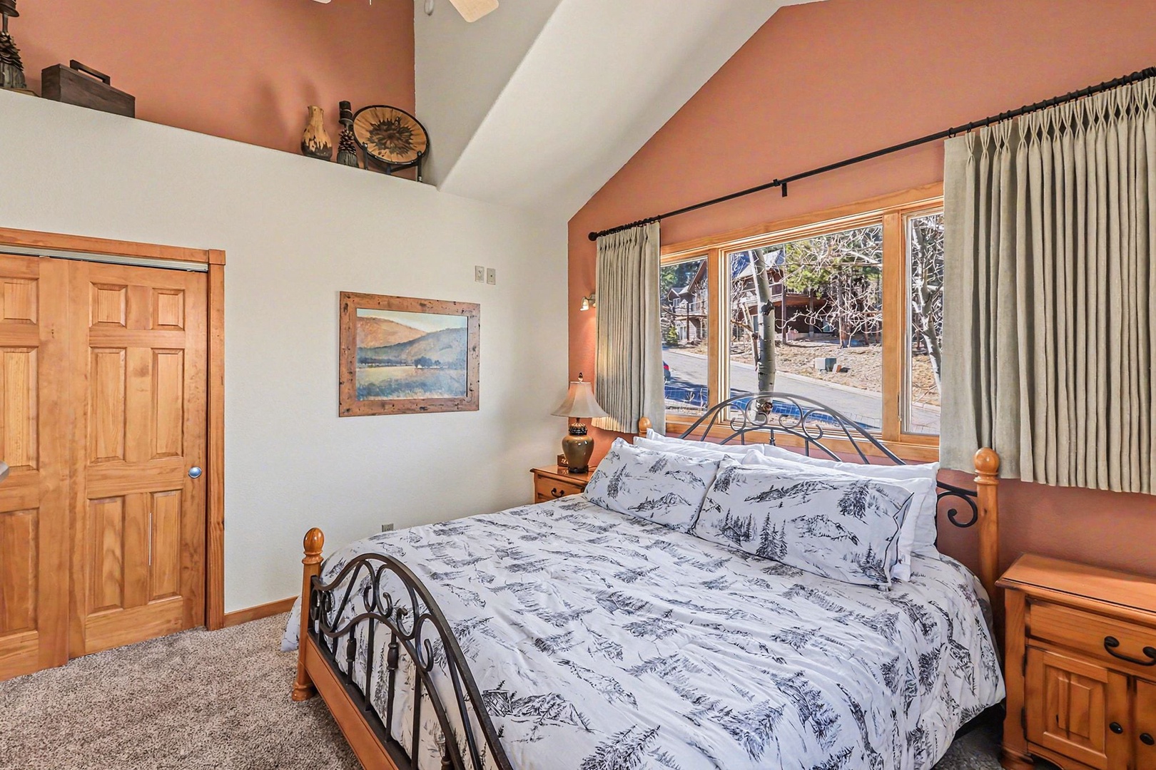Cozy mountain king bedroom with rustic charm.