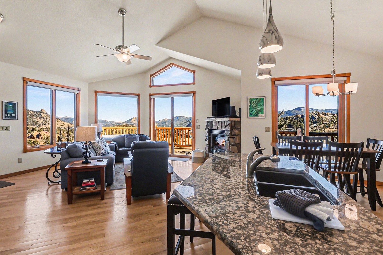 Relax in your open-concept haven with soaring ceilings, where panoramic mountain views frame every moment of your stay.