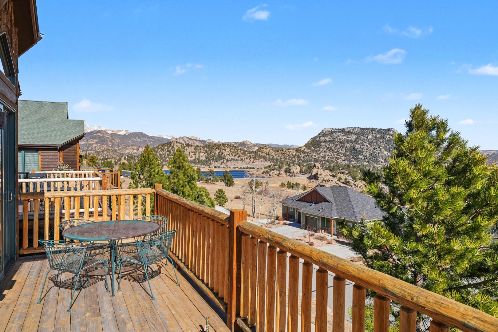 Relax on your private deck while soaking in the mountain views and the blue water of Mary's Lake