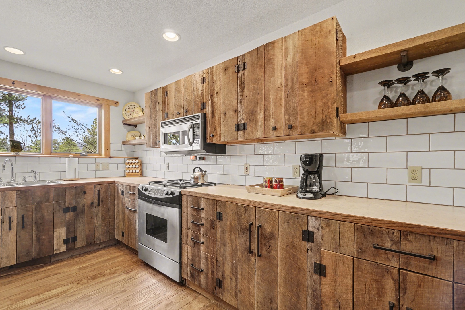 Your rustic kitchen combines reclaimed wood cabinets with modern appliances, creating a warm space where you'll love cooking meals together.